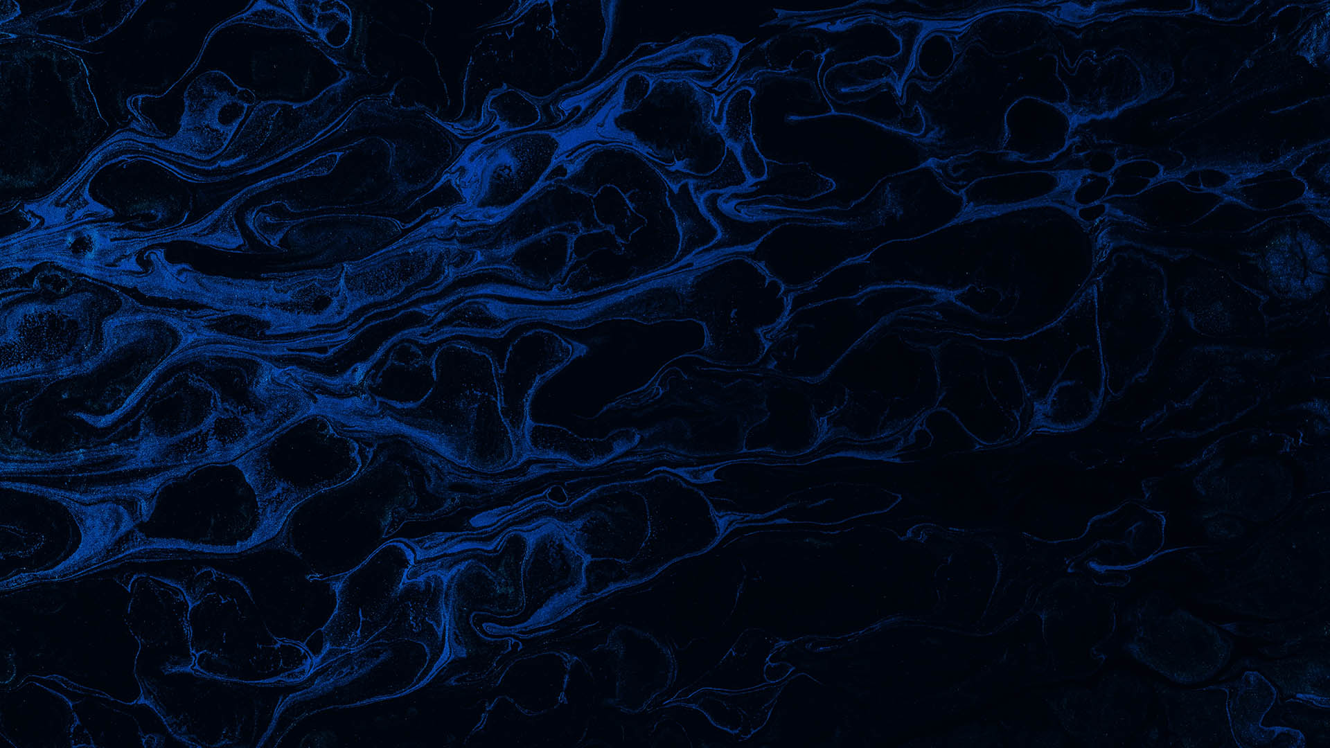 Dark blue almost black pearlescent substance. Its surface resembles waves in the sea.